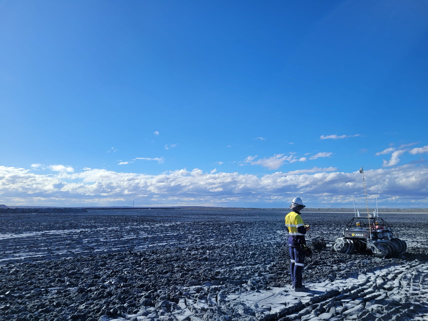 Arca scientist remotely operating a rover conducting Smart Churning at a mine site in Australia