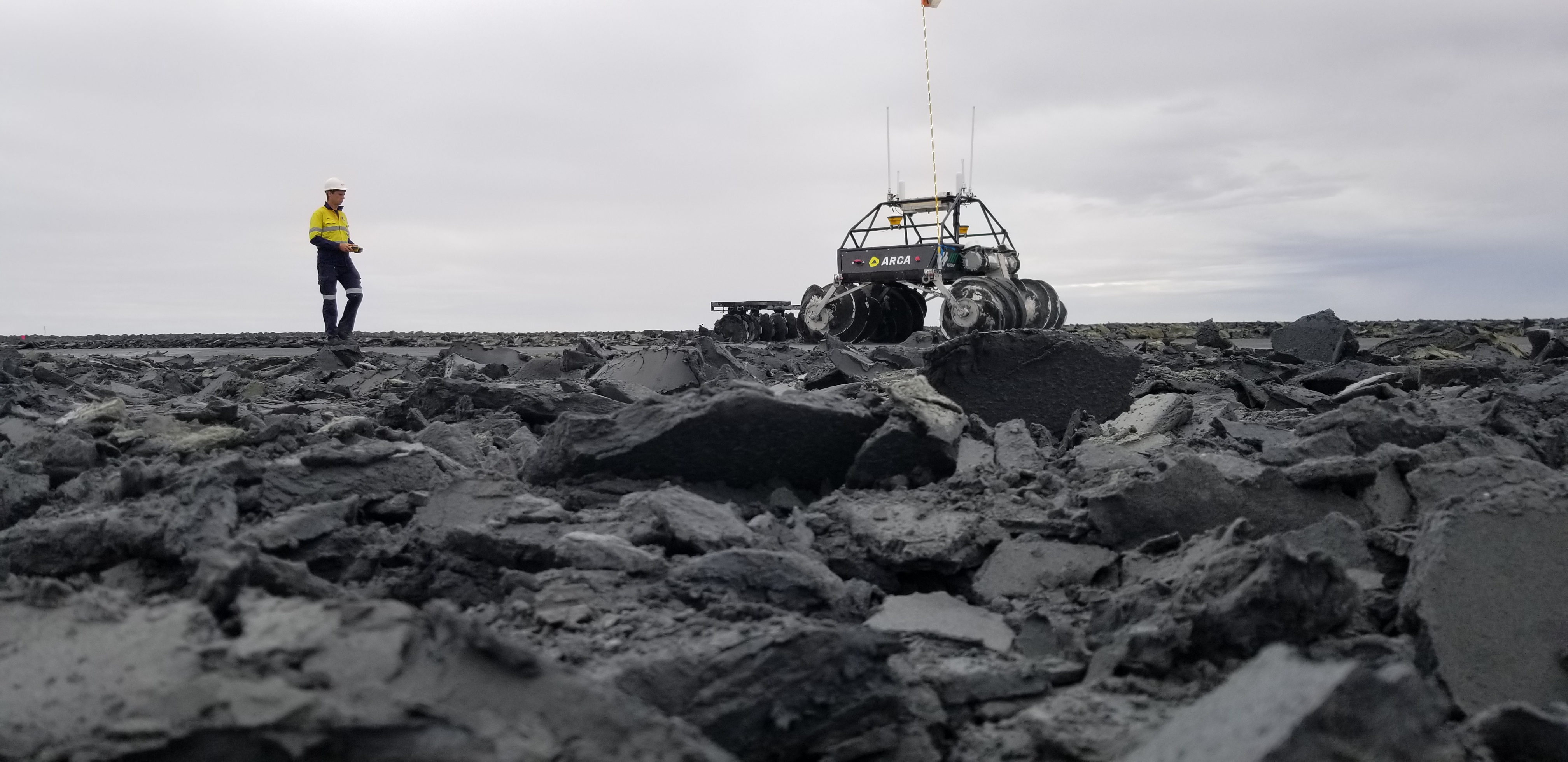 Scientist with rover at a mine site